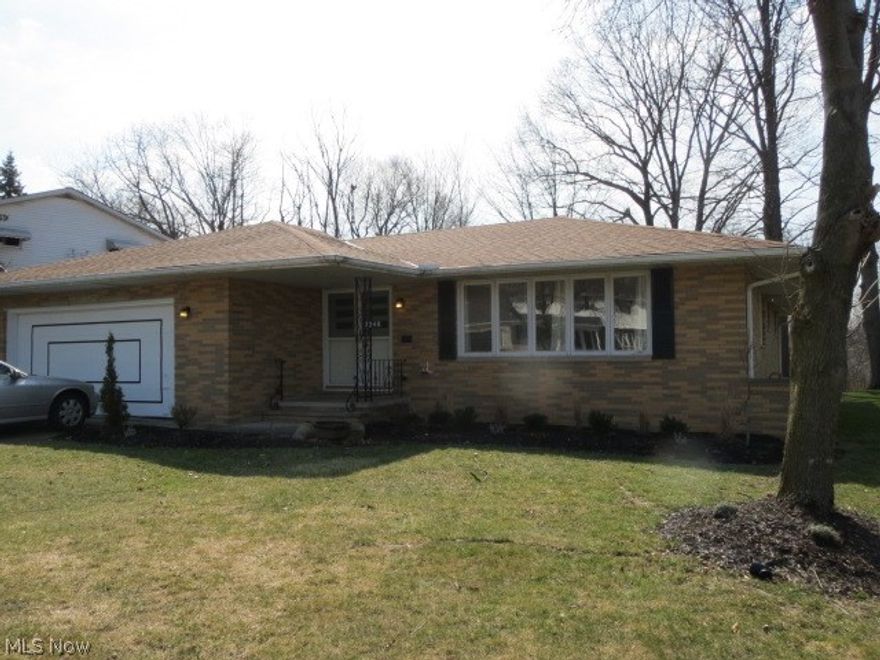 Welcome to Easy Living in this All Brick Ranch! Outside you will notice a brand new roof and a wooded lot..only thing behind you is nature! Walk in through your double front doors and find a spacious living room with beautiful hardwood floors. Formal dining room showcases built in china cabinet with storage. Completely updated kitchen features all new stainless steel appliance, modern tile back splash, and granite counter tops! Kitchen opens to cozy family room. Family room features a slider leading to your enclosed back patio. The tranquil views from the patio will be sure to please. All three bedrooms feature ample closet space and re-finished hardwood flooring. The main bath features dual granite sinks with a tile shower. Entire basement has been waterproofed from the exterior! Full basement is excellent for storage or future expansion. Low maintenance home, in an excellent location, on a great lot make this home a true must see!