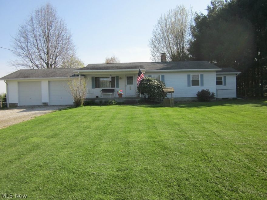 Welcome home to this 3 bedroom ranch, 2 full bath on 1.8 acres!  Country living with conveniences!  HUGE back yard is completely fences with 3 gates.  Enjoy the park-like back yard from the deck or sit on the front porch & watch horses across the street.  Country kitchen has a new bay window to watch birds & other wildlife.  Large 22'x11' master bedroom w/3 closets & a bay window that overlooks the back property.  Lots of storage.  Well maintained.  Newer windows throughout.  New well pump in 2007, water softener in 2005.  Basement has a workshop & a room with a wood burner.  Glass block windows in basement.  Two car attached garage.  Two out buildings.