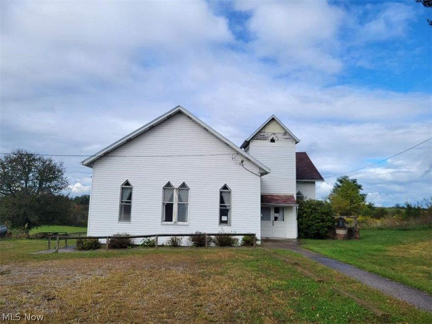 Unique opportunity! Most recently used as the Bartlett United Methodist Church.  All church fixtures are still inside, including pulpit and pews.  2 school rooms, small enclave off the main church, large basement for community hall.  Hall has newer kitchen cabinets, hot water heater and carpet.  1 bath on basement level.