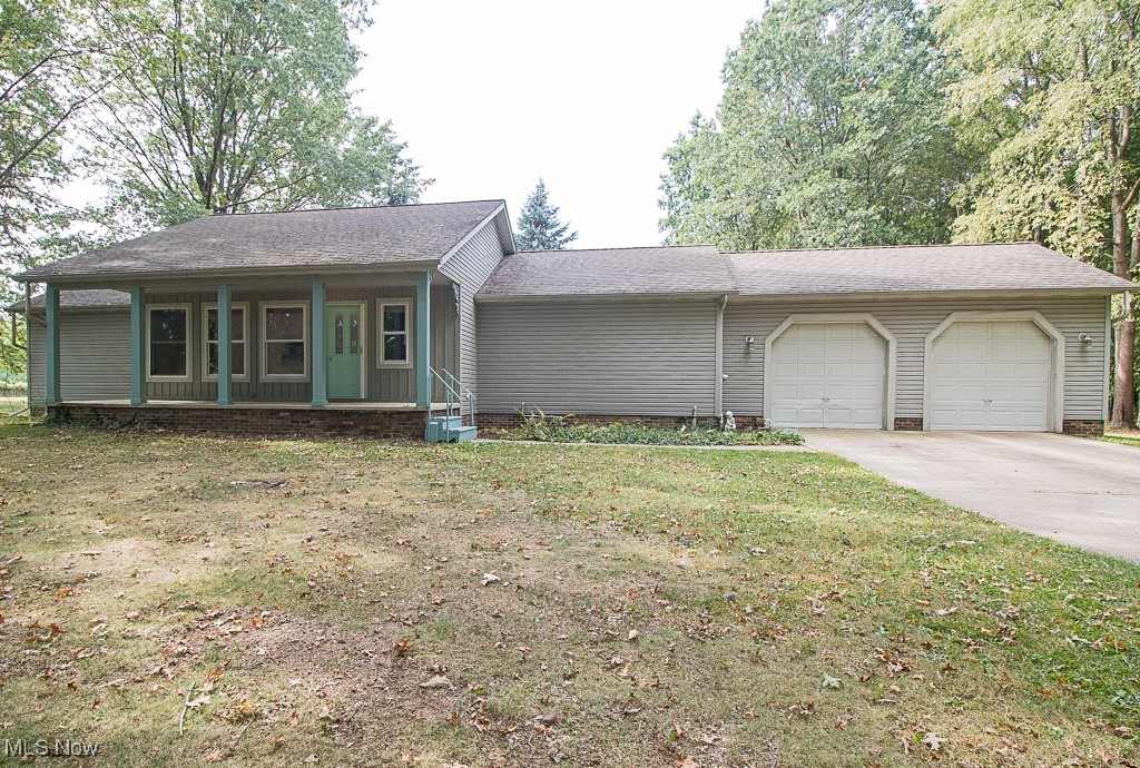 Would you be interested in 3.88 Acres of Seclusion within Painesville City? This rare find Spacious open floor plan Ranch features Privacy sitting behind a 24 x 90 White cinder block Building with a man door & standard overhead garage door leads to a Heated workshop area with 220 Electric. On the North Side of the Block Building is a 20-foot Overhead Door that leads to a Vaulted gravel/dirt floor area. Drive around the white building to a park-like paradise! Natural Light illuminates the vaulted Great room leading into Eat In Kitchen with island. This split Ranch with two Bedrooms features walk-in closets as well as Private full bath access. Full Basement. Two-car attached garage. Rear Deck overlooks the beautiful yard featuring wildlife visitors..wild turkey and deer. Convenient access to shopping, restaurants, and freeways.