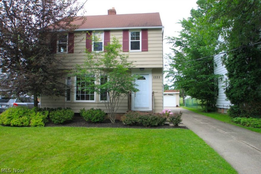 Charming South Euclid colonial situated on quiet tree-lined street featuring large 3-car detached dream garage (775sqft, 220V, full utilities, updated in 2012). Cozy living room with bay window and fireplace; Neutral décor and custom window treatments throughout the home. Hardwood flooring, updated eat in kitchen, spacious master bedroom with his/her closets, patio deck/balcony, finished basement.  Ample access to shopping, schools, and parks. All appliances stay; includes 1-year home warranty. Many other benefits including high efficiency furnace, 200amp main electrical service, and LeafGuard gutter system. Everything you need and more, just move in!