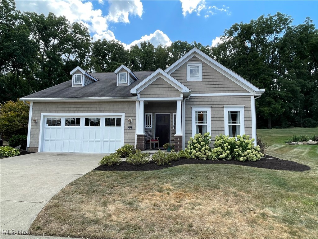 Stunning custom-built Villa style stand alone condo in Mudbrook Village. This home is in a premium location and has a gorgeous expansive park-like yard that backs up to woods for privacy. The open-concept layout features an eat-in-kitchen, formal dining, living room with gas fireplace and trayed ceiling, a den/family room, and a vaulted 4-season's sunroom. The master suite has a bath with a large shower, walk-in closet, and a beautiful view of the back yard. Upstairs you will find the second bedroom with a walk-in closet, as well as a huge storage/utility room which could easily become more space if needed or a third bedroom. You will love the custom features that were added to this home like 9' ceilings, an abundance of windows to let light in, lots of trim work and crown mouldings, and a patio out back. The garage is over-sized with an area for hobbies or tools. Better check this one out!
