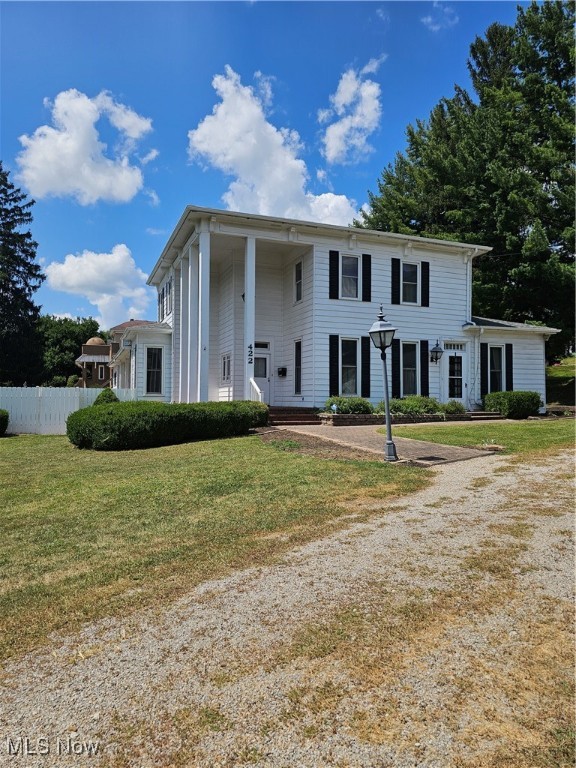 If you’re searching for a home in McConnelsville packed with bonus features, this one is a must-see! Located on N Kennebec, its curb appeal is undeniable—stately columns, large windows, a white privacy fence encircling your own in-ground pool and a brand new roof, gutters, and downspouts!
Inside, you’ll find generously sized rooms, decorative tin ceilings in some downstairs spaces, rich woodwork, solid wood doors, and abundant built-in cabinetry for all your storage needs. Beneath the carpet in most rooms and stairs, it’s believed there are beautiful hardwood floors waiting to be uncovered and restored.
The eat-in kitchen features Mock Cabinets, Corian-style counters and bar seating at the peninsula. On the main floor, five versatile rooms offer endless layout options—previously used as a dining room, living room, family room, office, and media room/bedroom. Both levels have a full bath and a half bath for convenience. The dining room has a built-in corner cupboard adding extra charm!
In the “office,” built-in shelves surround a vintage roll-top desk (included with the home), and between the office and living area, you’ll want to admire the intricate woodwork above the doorway. Upstairs, the wide staircase is flanked by sturdy handrails leading to three bedrooms, storage areas, and additional baths. Many windows feature charming wooden shutters and decorative treatments, while the welcoming foyer showcases a stained-glass window.
Step outside to your private retreat—an in-ground pool with diving board, brick patio, gazebo, and a covered porch with a swing. The attached garage is conveniently accessed from the porch.
Adding to its charm, this home holds a piece of local history--hymn writer Lelia Morris once lived here, penning many songs still found in area church hymnals. (Per seller's family)
This property is brimming with character and versatility—schedule your private showing today to experience it for yourself! The home is being sold "AS IS"!
