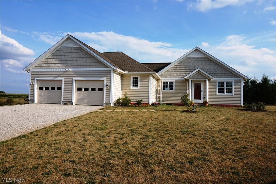 Great home sits on 7 acres in the Holmes County countryside.  Driving in you pass a small vineyard as you pull between the 2-car attached and the 3-car detached garage.  When you make your way to the front door be sure to take time to notice the meticulous landscaping.  The 1,612 square foot home features 2 bedrooms, 2 full baths, custom Mullet kitchen, oak trim, solid oak doors, geothermal heating and cooling, propane fireplace, wide hallways and doors, and many Anderson windows for ample natural lighting. All stainless steel kitchen appliances stay with the home.  The large open basement with insulated block walls is ready to be finished to your style.  From the great room you can open the French doors to the stamped concrete back porch.  This is a fantastic place to take in the view of the beautiful flower garden and fully stocked pond in the backyard.  This is a solid home that has been very well maintained.  Call today for your private showing.