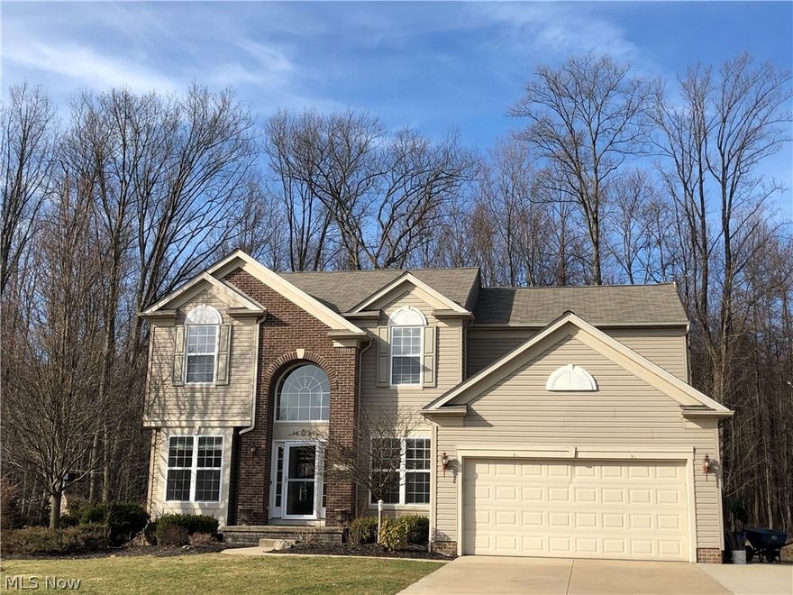 This home is situated on the cul-de-sac at the end of Wilmington Drive in Broadview Heights on an amazing wooded lot! A large Trex deck, stamped concrete backyard patio (with built in fire pit) and stamped sidewalk leading from the extended 3-car wide driveway are just some of the many exterior features. Convenient access to walking trails and community pool and party center. This home boasts 4 bedrooms and 3.5 baths (1 Full bath in basement). The first floor includes a 2-story foyer, office, living room, dining room and sunroom. Adjacent to the first floor laundry, is the kitchen with a large walk in pantry, granite kitchen counters and cherry cabinets. The full, finished basement provides lots of room for entertaining and includes multiple built in storage areas.