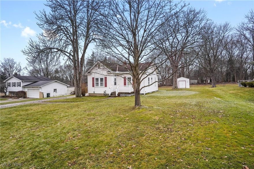 This charming and cozy ranch home offers a functional layout, perfect for comfortable living. Featuring a good-sized kitchen with a nice eating area, it provides plenty of space for cooking and gatherings. The home includes a full basement, offering additional storage or potential for a finished living area. Hardwood floors under all carpeting, ready to be revealed and restored to their original beauty if you wish. Sitting on a large lot, the property offers ample outdoor space for gardening, entertaining, or simply enjoying nature. A two-car detached garage provides plenty of parking and storage, making this home a perfect blend of character and convenience.   Radon mitigation system installed 2024, Hot water tank - 2017, Furnace - 2012, Roof - 2011.
