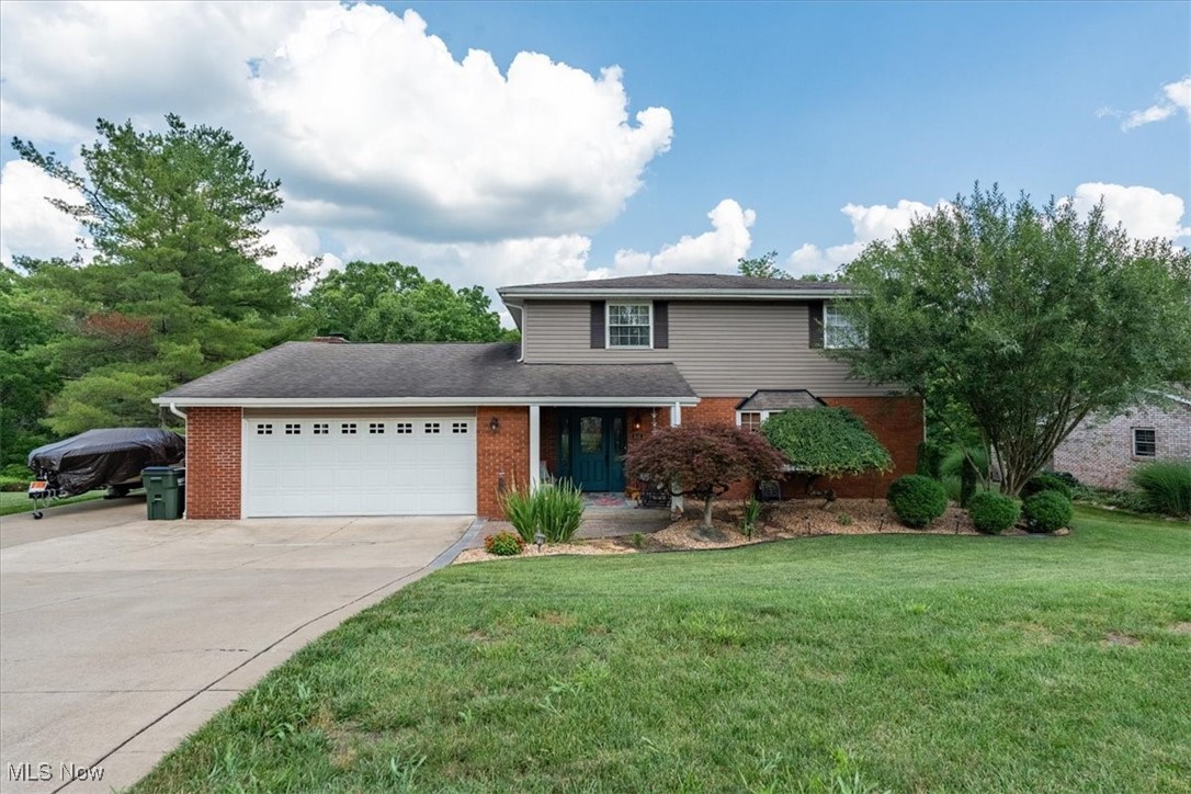 Picture yourself in this traditional two-story brick and vinyl home in Devola. This well maintained home offers 5 bedrooms and 2.5 bathrooms and is located on a quiet cul-de-sac. Other amenities include a spacious front porch, living room with a bay window and added fireplace, formal separate dining room, kitchen with granite countertops and hardwood flooring, family room just off the kitchen with space for an extra table, gas logs fireplace and double doors to the rear deck. The upper level offers four bedrooms and two full bathrooms. The lower level has a huge recreational/game room perfect for leisure and entertainment with a bar and 5th bedroom that could be used as an office. The laundry room offers tons of storage. The attached oversized two garage offers a 2nd laundry hook up and driveway with an extra parking pad. The 3/4 acre lot is wooded at the rear, is nicely landscaped and offers peaceful enjoyment. Don't miss your chance to tour this beautiful home and make it your own!