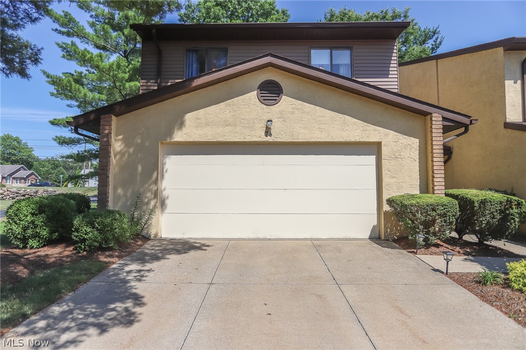 A remarkable end unit Munroe Falls condo with 3 bedrooms and 2.5 baths. This updated unit is over 2000 square feet, and features an open concept with a two story great room with a built in bar. There are 2 fireplaces, with one in the open kitchen sitting/family room. The updated kitchen has wonderful wood block counter tops, newer cabinets, stainless steel appliances, and a nice sized eating area. The baths are all updated, and there is a first floor laundry. The bedrooms are all large, with a full master suite with double sinks. An attached 2 car garage, additional parking, a patio, and so much more.