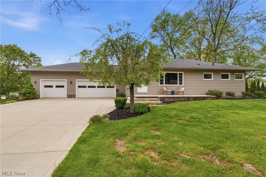 Welcome to 367 Willson Ave, a beautifully updated ranch offering modern style, functional living space, and great indoor/outdoor appeal. Step inside to a bright and inviting living room featuring a statement fireplace, large picture window, and warm-toned flooring that flows throughout the main living areas. The updated kitchen offers white cabinetry, granite countertops, stainless steel appliances, modern fixtures, and an eat-in area that opens nicely to the dining space. The main level includes comfortable bedrooms and updated bathrooms with clean, modern finishes. The finished lower level provides additional living space perfect for entertaining, a rec room, office, playroom, or workout area. Outside, enjoy a spacious yard, patio area, and an attached garage with plenty of driveway parking. With neutral finishes, stylish updates, and move-in ready appeal, this home is one you won’t want to miss!