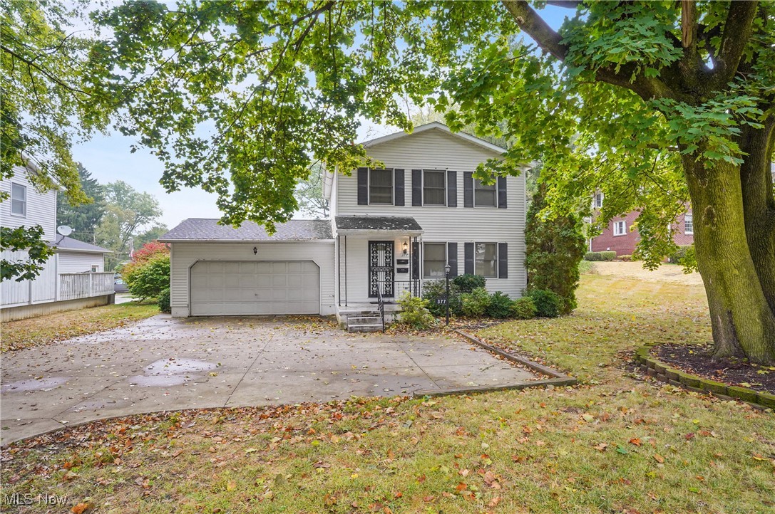 Meticulously Maintained Colonial in the Heart of Mogadore! Proudly owned and lovingly cared for by the original owner since it was built in 1991, this charming colonial offers timeless quality and thoughtful updates throughout. Step inside to find an open-concept, eat-in kitchen with an abundance of oak cabinetry, generous countertop space, and modern appliances—perfect for any home chef. Rich oak trim, solid doors, and elegant crown molding add warmth and character to the entire home. Upstairs, you’ll find three comfortable bedrooms, including a spacious master with dual closets, and a full bathroom. The first floor features another full bath, a large living room ideal for entertaining, and that bright, inviting kitchen area. The basement offers high ceilings and excellent potential—create the rec room, home gym, or media space of your dreams! Enjoy the convenience of an attached 2-car garage, plus a paved turnaround and additional parking out front. The backyard is your personal retreat, complete with a large deck—ideal for soaking up the sun or hosting summer BBQs. For added peace of mind, the seller is including an America's Preferred Home Warranty. Don't miss this rare opportunity to own a beautifully maintained home in a prime Mogadore location!