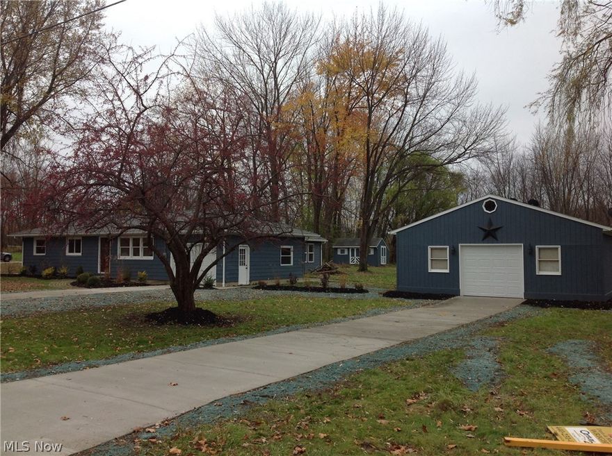 A home in the country. Space for a garden. A pole barn for you to tinker in. (well actually, it holds 6 or more cars with room to spare). Race fans, woodworkers, home business, contractors, or just collectors...this one's for you! Enough about the barn... how about the house? This great ranch has 4 bedrooms, 2 new full baths, a large mudroom with walk in pantry space, and ample coat closet for every season. Moving on to the the spectacular vaulted kitchen, All new cabinetry, custom designed for great entertaining, and every day meals. We reclaimed a vintage work space island and added a new marble top. Perfect for baking, food prep and breakfast chitchat! Paint and tile is soothing grays, blues and tans. Granite counter-tops, New stainless appliance package, & hardwood flooring complete the look making this home truly move in ready and worry free. New mechanicals include tie in to city sewers and new heat pump for year round comfort. New roof too! Peace of mind lives here, ENJOY!