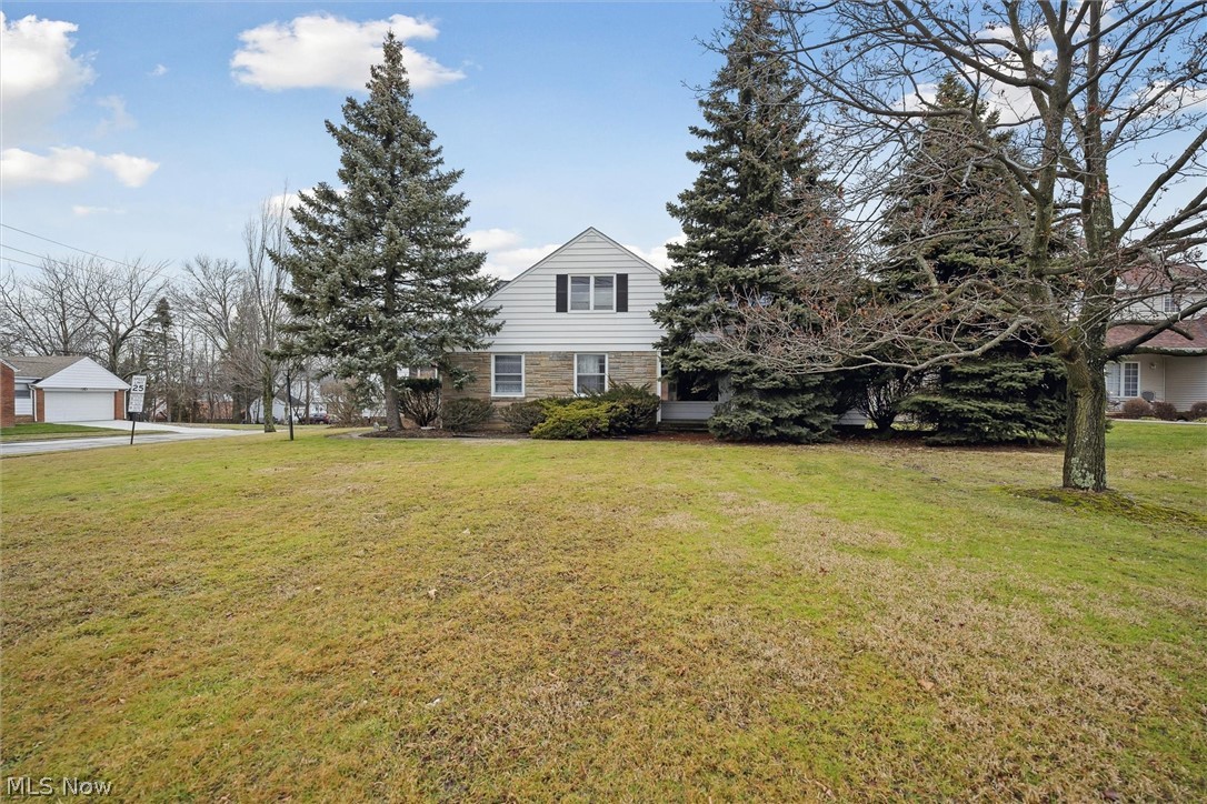 Large home with driveway off of the side street Clearview. This Bungalow has so much to offer. You just need to add your touches. The living room features a wood burning fireplaceand hardwood floors. Dining room with a wall of built in cabinets for your family china. Eat-in kitchen w/ lots of cabinet and countertop space. The first floor has 2 generously sized bedrooms and a full bath plus 3 bonus rooms which could be 2 more bedrooms and a walk in closet or a fantastic home office with it's own private side entry. There is also a first floor laundry. The 2nd level has 2 more extra large bedrooms which could be a fantastic master with a full bath. Large partially finished basement which could be a great family room or kids playroom. Plenty of room to entertain family & friends! Close to many restaurants and shopping.