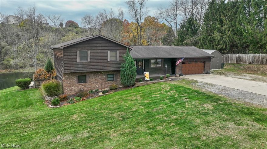 Welcome to this charming tri-level home nestled in a beautiful and private setting just outside of St. Clairsville, Ohio. The main floor features a spacious open-concept layout with a large kitchen and dining area, perfect for everyday living and entertaining. The upper level includes a master bedroom with direct access to the back deck and an attached master bathroom. Two additional bedrooms and another full bathroom complete this level, offering comfortable space for family or guests. On the lower level, you'll find a generous recreation room along with a fourth bedroom, providing flexible living space for a home office, guest room, or entertainment area. The basement includes an additional bathroom and a convenient laundry room. Outside, the property offers ample parking with a concrete driveway and an attached two car garage. Relax and take in the peaceful surroundings from the back deck overlooking a beautiful pond, or enjoy the view from the patio just outside the lower level.