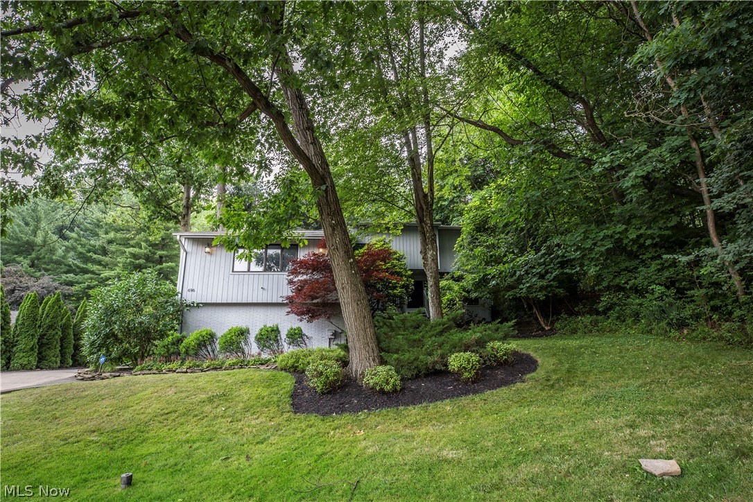 This contemporary gem is nestled in the hills of Merriman Woods; it's on a quiet cul de sac, yet it's also a short drive to schools, shopping, dining, entertainment and travel routes! The home's floor plan is very spacious & open, boasting 4 extra large bedrooms upstairs & there is also potential for a 5th bedroom in the finished lower level. Other features include 4 full bathrooms, upstairs laundry, sauna in the master suite, beautiful bar area between the great room and family room and a finished lower level, that boasts custom built in cabinetry (2019). Outside a multi tiered deck, complete with hot tub, awaits for entertainment & enjoyment. The owners have completed many upgrades to include interior painting, new carpeting (2021), new lighting & ceiling fans, mini split units in the bedrooms (2020), new furnace (2018), new tankless hot water heater (2019) & new washer & dryer/laundry room remodel (2019). Don't miss!