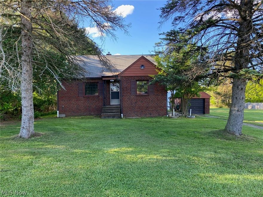 Looking for Some Outdoor Space? One and a Third Acres in Brunswick Hills! Brick Bungalow Ready to Move Into! Just Bring Your Decorating Ideas and a Little TLC! Freshly Painted Interior! Updated Full Bath with New Sink, Faucet, Toilet, Tub and Shower Surround & Flooring!! Kitchen has Been Updated with Freshly Finished Cabinets & Hardware and a Built in China Cabinet. The Stove Fridge and Microwave will Stay!  2 First Floor Bedrooms and Spacious Upstairs Master! First Floor Bedrooms have Hardwood Floors! Master Bedroom is Finished in True Craftmanship in Knotty Pine with a Cedar Closet! Full Basement for Lots of Storage! Second Fridge and a Freezer will Stay (both work)! Glass Block Windows in Basement! The Gas Furnace, Central Air, Roof and Electric Panel are Somewhat Newer (Exact ages unknown)! Hot Water Tank is about 3 years old!  One Car Detached Garage Near House and a Two Door 4+ Car Garage/Outbuilding 24x32 (Block Barn with Concrete Floor) w/Newer Roof plus additional 22x24 Lean to w/rear Door near the Back of Lot! City Water is at the Street! Seller has Never Lived on Property! To be SOLD AS-IS! 184-Foot-Wide Lot, it appears that the Lot could possibly be Split, and a second house built? But Seller makes No Warranties!