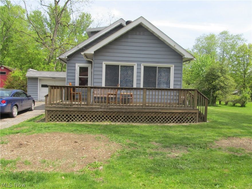 Super sweet 2 bedroom cape cod on dead end road LaBrae Schools.  Enjoy the open concept from the living room, to the dining room & kitchen.  First floor bedroom.  Updated/remodeled first floor full bath with ceramic tile.  HUGE bedroom upstairs with walk in closet/could be easily converted into 2 bedrooms.  Wrap around decdk with an inviting enclosed sunroom entry.  Home has newer windows, high efficiency furnace, & sump pump.  There is a one car attached garage with easy access into the home thru the rear door. Septic is updated & meets TCHD regulations.