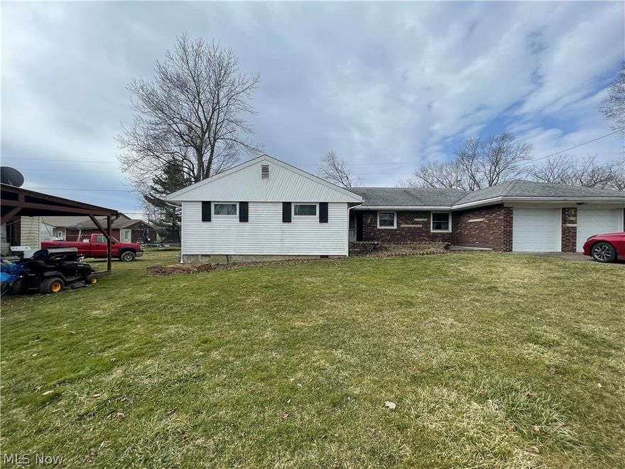 HOME
Village of Miltonsburg home built in 1959 on crawl space. 1.5 ACRES.  Home is addressed Woodsfield, OH  1790 square feet. 3 bedrooms and 3 baths.  Kitchen/dining room area overflowing into huge laundry room. 13 X 21'11" room with bar and gas log fireplace always used as a dining room. Living room 13'5" X 19'11". Dining room and living room both having large vinyl windows to view back yard overlooking pond at back of property.  

3 bedrooms: 9'10" X 13;  9'10" X14'8";  11'8"X12'. Master bedroom has masterbath has shower.   Main bath in hallway offers double sinks and tub/shower.  

Front door entrance into large entry area with coat closet, where newer furnace has been moved to.  Home has gas forced air furnace and central air.  

Exterior of home is brick and vinyl siding. Vinyl windows. Concrete front patio porch and back patio porch.  

 Back building, used to be an apartment. Maybe could be again or would make a nice storage building.  The building also has its own sep