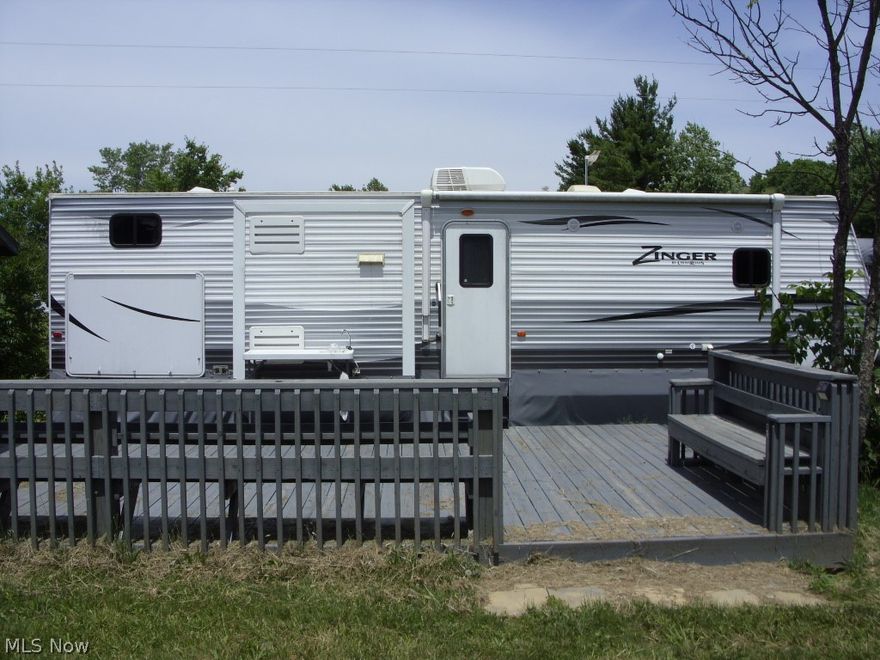 Lot # 2072 in Buffalo Hills Camping Sub-division... with a 32' 2017 Zinger Bunk-house Camper, 1 12' x 16' Storage building and 1 12' x 20' storage building, a 16' x 24' deck... Very nice setup...