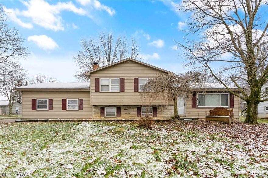 Welcome to one of the most desired neighborhoods in Hubbard! 603 Meadowland is a lot larger than it appears and has tons of storage! As you walk in the front, you are greeted by a large living room area with laminate flooring that leads into the large eat in kitchen. The kitchen offers wood cabinetry, white brick backsplash, area for a dining room table and a beautiful dark stained wood ceiling! The kitchen has a heated enclosed porch off the back overlooking the backyard and the above ground pool. The lower level offers a large family room with a brick fireplace and a full bathroom with a walk in shower and new vanity. The upstairs offers 3 nice sized bedrooms and great closet space in each! Another full bathroom has been updated with a new vanity, new flooring and tub surround. Hardwood flooring under the carpets in the bedrooms and hallway. The basement offers the 4th bedroom, a workshop area and the utility room with the laundry and space for indoor storage. The 3 car garage is absolutely amazing with an additional enclosed space that can be reinvented to your specific. 100 AMP service. Forced Air furnace with new AC. Dimensional shingled roof. Newer hot water tank. Hubbard School District.