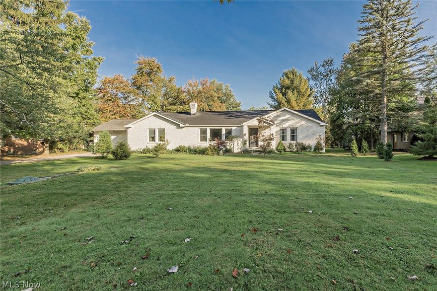 This masterpiece 4 bed 3 full bath ranch in Mayfield Heights is full of major updates! Step into a living room with beautiful wood flooring, a wide/spacious layout, recessed lighting, and stone set fireplace that runs the length of the wall! The dining room features gorgeous ceramic tiling, double skylights and added access to the deck. Through a small mudroom and main level laundry, you can find a full bath and the incredible eat-in kitchen with recessed lighting in the vaulted ceilings, oversized bar with granite counters running the length of this space, a separate fridge/freezer along with commercial level stove and appliances!  The master bedroom has plenty of space, including walk-in closets and its own private bathroom with walk-in shower and a sun tunnel for added natural light! 2 of the remaining 3 bedrooms have new carpet and are separated by the 3rd full bath. The basement is completely finished with a large carpeted rec room with fireplace. This home includes a tankless wat