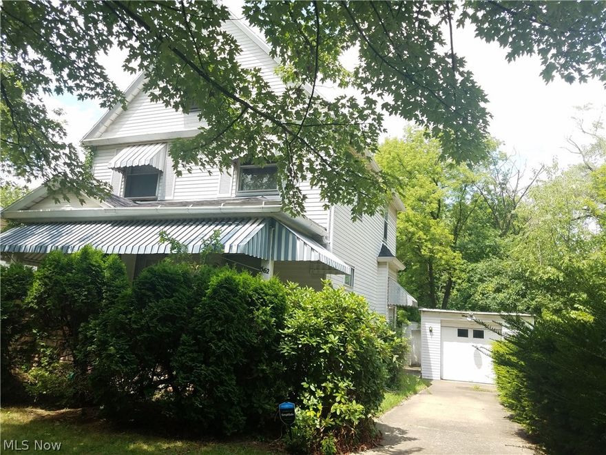 This 5 bedroom home will make for a great investment property. Super sized 3 story home with alum. siding, many replacement windows and decent Roof.Even awnings over the large covered front porch! 1 & 1/2 garage with geni! Concrete drive and beautiful landscaping and hedges for privacy. Park like back yard.  This property is being sold as-is and seller will not do repairs. Large foyer with high ceilings and painted staircase with ALL the spindles!,Living room and formal dining room have french pocket doors to divide them if you like. These rooms are carpeted but hardwood floors are underneath. Super sized Kitchen with lots of natural wood cabinetry, lots of counter space and built in Dishwasher. Newer Gas stove and stainless steel  fridge stay at full price.This kitchen is 11 x 18!  Upstairs features a full bathroom that is larger than most, room to make it special! 3 large bedrooms here with carpeting over hardwood floors, nice size closets too, and many of these windows have been rep