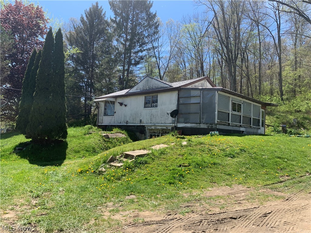 2 Bedroom 1 Bath home. 6 car garage on cement slab. Roof on home and garage only 5 years old. Some new electrical and plumbing has been done. Eat in kitchen. Living room. Full basement. With a little TLC this could be a great starter home. Or add this home to your investment properties. Almost an acre of land.