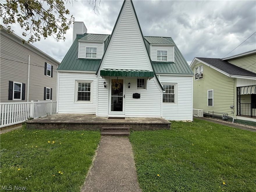 Nicely updated 3 BR home with updates including metal roof, vinyl siding and most windows, new laminate flooring on first floor, refinished hardwood upstairs and new custom storm doors. Enjoy the cozy living room with fireplace, dining room with rustic built ins, and a sunroom. Alley access for off street parking and Convenience. All measurements are approximate.