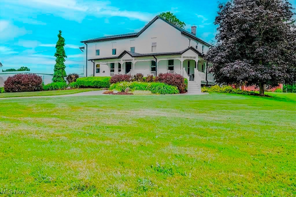 Discover the charm and versatility of 4823 Kirk Road—a beautifully updated 2,783 sq ft farmhouse set on over 4 pristine acres. Featuring 5 spacious bedrooms and 2.5 baths. The wraparound porch is absolutely beautiful and the attached 3-car garage is extremely convenient along with a partially finished basement. Recent upgrades include a new asphalt driveway (2023), roof and siding (2021), windows (2022), 2 sump pumps with batterry back up. A remodeled kitchen 2021 and bathroom (2023). The ventless gas log fireplace, landscape lighting, and modern mechanicals like the new boiler, A/C, and 80-gallon hot water heater ensure comfort and efficiency. Outside, you’ll find an impressive array of buildings: a 4,080 sq ft storage facility with rental or equipment income potential (plus 1,440 sq ft of insulated storage), a 3,200 sq ft pole barn with horse stalls and an indoor riding arena, a 1,040 sq ft tool shed, a garden/potting shed, and a turn-of-the-century bank barn with fenced pasture areas. Newly remodeled bathroom and two fenced pastures. Even a 50 amp outlet for a camper. The grounds are adorned with apple and chestnut trees. With extensive updates, a whole-house water filtration system, and a pre-sale inspection already completed, this property is move-in ready and packed with love and opportunity for its new owners!