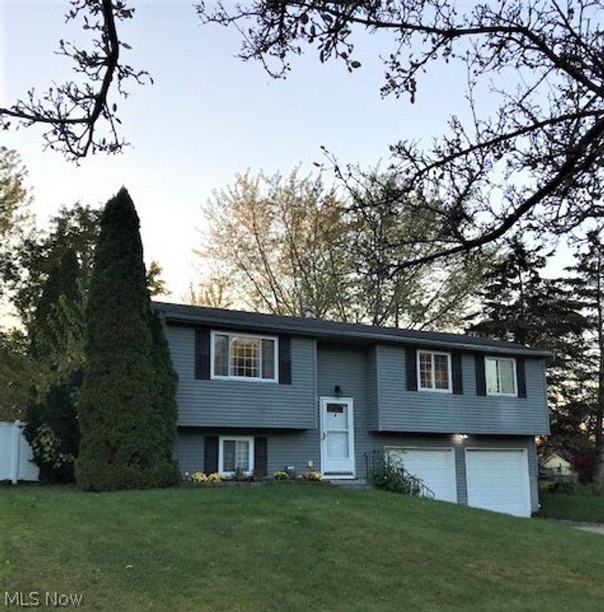 Put this one on your list to see.  Great home, location and yard! Inviting curb appeal with a fantastic back yard for entertaining or just relaxing at home.  The entire back yard has a vinyl privacy fence, a separate fenced area for pets, a 25 ft. above ground pool with a new liner, two vinyl decks, one for the pool and the other leading to the house and a storage shed for pool equipment storage.  All this with minimal maintenance. Inside you'll find an open floor plan with the finished lower level with easy care laminate flooring that includes a half bath for 1544 total sq. ft.   The kitchen features a unique rustic appearance with barn siding accents and stainless appliances.  Easy care laminate flooring continues in the living room, kitchen and eating area.  The spacious living room leads to the dining area where sliding doors were added to access the deck.  The neutral decor is found throughout, including the full bath and bedrooms.  Home has been waterproofed and includes a transferable warranty. Sellers are also offering a home warranty.  Move in and enjoy!