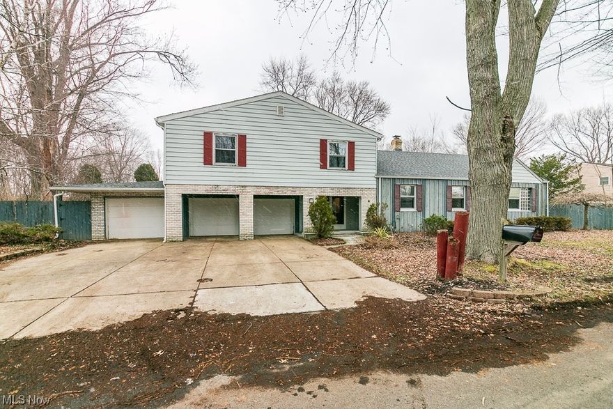 This unique one-of-a kind sprawling 5/7 Bedroom (with 2 Bedrooms, 2 Full Bath options on 1st floor) with in-law suite potential has 4 FULL bathrooms , 3 car garage and is on 1/2 acre fenced lot.   This is a fantastic family home dominated by unequaled square footage, large living room and bedroom spaces. Outside, the fenced-in yard and wrap-around deck (some of which needs replaced) offers privacy with a large yard for outdoor fun!  Walking distance to Chagrin Lagoons Yacht Club. The Owner's Suite bedroom has a walk-in closet, it's own bath and a balcony deck for enjoying summer nights.  All the room sizes both on the first floor and second floor are spacious.
 Current owners bought it as a bank-owned foreclosure and brought it back to life...just didn't quite get it finished.  The roof had a total tear-off and new shingles in 2022, updated interior plumbing and heating (Weil McClain Boiler, Rinnai Tankless Water Heater!), new carpeting, flooring, drywall.  It's move-in ready, priced