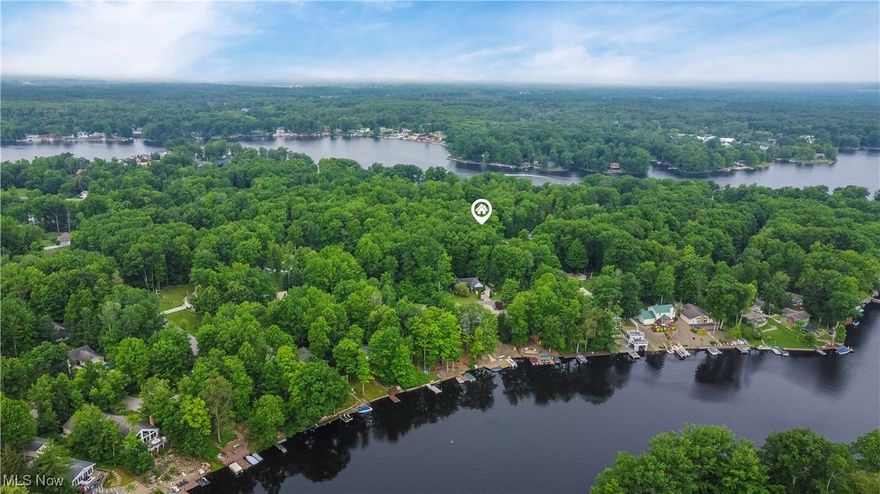 Opportunity awaits for Spring/Summer 2026! Purchase this lot for an INCREDIBLY low price and have full access to all of the amenities that Roaming Shores, Ohio has to offer! Lake rights to Ohio’s LARGEST private lake! Boat and fish the days away on the 470 acre lake, with a full-service marina/store, a three-lane paved boat ramp, and plentiful largemouth/smallmouth bass, crappie, silver/channel catfish, perch, and bluegill-all supported by an active stocking program maintained by the Fishing Club!

This private lake community also offers two beaches, four heated pools(two adult, two kids), a seven-mile water-skiing loop, parks, playgrounds, the Western Reserve Greenway Trail, volleyball, basketball, tennis and pickleball courts, baseball fields, a 3,500 sq. ft. clubhouse, and over 20 outbuildings and picnic pavilions (with grills and a concession stand). Roaming Shores residents enjoy the safety of a full-time Police Department, the convenience of a nearby grocery store, and a year-round lakefront restaurant-Paradise Bay. Several public golf courses and campgrounds are within 20 minutes, and the central location offers tranquil living just one hour from Cleveland, Erie, and Youngstown. 

You have the option to build your dream lake-area home for year-round living as well! The lot is just under a quarter acre, flat, level, and has 75 feet of frontage, with gas, electric, public water and public sewer available at the street! This lot is ONE BLOCK away from the water! Now’s the time to secure your Roaming Shores getaway-before someone else does!