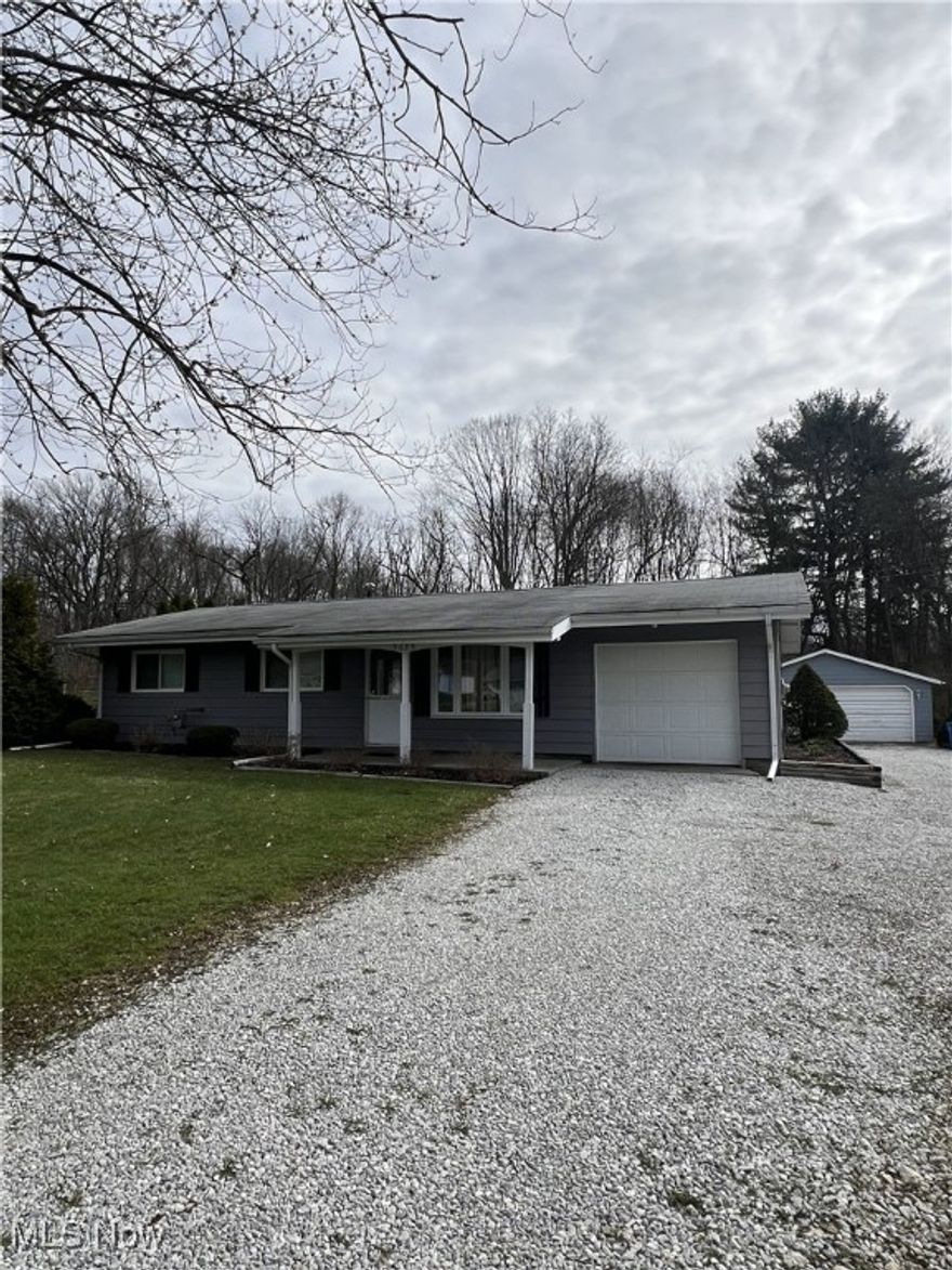 Welcome home to this lovely ranch situated on just under ½ acre!  This home is located in the quiet neighborhood of Melody Village in Norton City School District.  With 3 bedrooms and 1 full bath, this home makes for easy first floor living.  You will find plenty of storage in the attached 1 car garage, detached 2 car garage, or shed.  Updates include laminate flooring throughout, roofs (house – 2018; detached garage – 2019), accent wall in the living room, paint, rustic pine trim, well pump, washer/dryer, and more.  Enjoy the seasons from the covered front porch or back patio overlooking the flat backyard for easy maintenance.