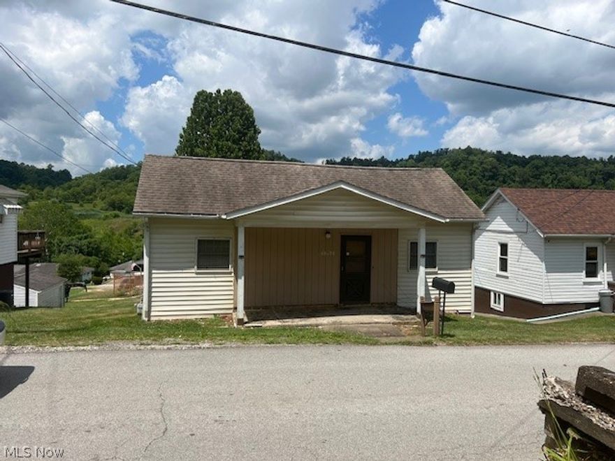 Cozy  1 bedroom with 1500 sq ft. The previous owner used the basement room as a second bedroom. The house needs some cosmetics, but the roof, furnace, AC, and water heater look good. This house is an estate and the heir knows very little. His mother lived there and parked in the front, but there is a dead-end alley behind the home perfect for a parking area, new garage, or carport. The house is located just a block from the bottom of the Blaine bridge, this house is close to everything. 5 min. to the mall/ plaza area and 10 min to Wheeling. It's a great little fixer-upper for the investor or flipper! better hurry!