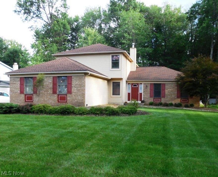 Sensational 4 bedroom, 3.5 bath colonial with 2 car side entry garage situated on an oversized private, wooded lot. Featuring a First floor Bedroom and Full Bath w/walk in shower , nice size family room with beautiful hardwood floors & woodburning brick fireplace , Open Eat-in kitchen with extra wide sliding glass doors that lead to a huge deck, Formal living and dining room, first floor laundry/Mud room. 3 bedrooms & 2 full baths upstairs including an oversized Master suite with walk-in closet, attached master bathroom complete with dual sinks, soaking tub and shower. The partially finished basement makes a great recreation room and includes a 1/2 bath. The large 1/2 acre lot resulted from the current owner purchasing an additional lot extending the depth of the back yard .    2010- new front door & entry way, new dishwasher, new garage door & garage door opener.  New carpet throughout in 2015.  Roof in 2012.  Don't miss making Villa Grande your next community to live in!