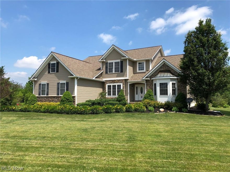 Built in 2007 by Enzoco, this 1-owner home is ready to move in. Spacious 1st-floor master suite features huge, walk-in closets, en-suite bath with deep soaking tub, separate shower, dual vanities, separate commode room. Magnificent Great Room boasts vaulted ceilings & fireplace, open to the eat-in kitchen with plenty of cabinet & granite counter space, appliances included. 3 more bedrooms & a full Jack-n-Jill bath upstairs. Other features: private deck & patio with fire pit & a peaceful view of the 2.7 acre yard, 3-car garage, full basement--ready to be finished, formal dining room, 1st floor office, separate stairs from garage to basement. Chardon Schools.