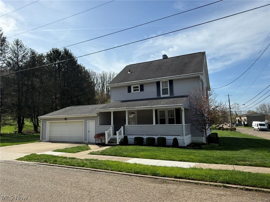 Charming 3 bedroom, 2 bath vinyl sided home.  Spacious entry foyer with original woodwork.  Oak kitchen includes refrigerator and gas range.  Waterproofed lower level includes a partially finished rec room, full bath and laundry room.  Vinyl windows throughout.  New gas hot water heater in 2025.  2 car attached garage with opener.  Enclosed rear porch and 23 X 9 rear patio.  Large, level corner lot.  Taxes reflect the seller receiving a homestead credit of $366.92 annually.  New shower stall in the garage stays.  Appliances are not warranted.  Gutter guard installed.