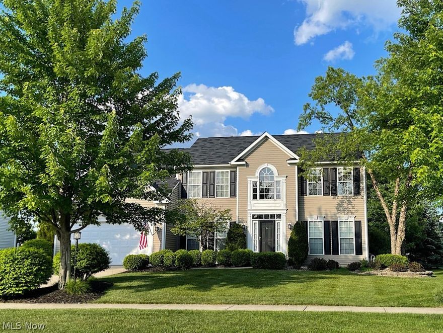 If you're one who enjoys a contemporary look, and appreciates feeling pampered, you will love this larger than life, over 4000 sq. ft. 4 bedroom beauty in Cobblestone Park. Every room, from the beautiful kitchen to the lower level, has been carefully-planned. You'll enter through a lovely two-story foyer with warm-toned flooring. On the way to the kitchen you'll pass a convenient first floor office on the way to the heart of the home, where you'll never be far from the action. If you're a cook, you'll love the gourmet kitchen with stunning white cabinetry, granite countertops, all of the appliances, and an oversized 10 ft. island with pretty glass front cabinets, seating and storage. It overlooks a big family room with 9 ft. ceilings and a wall of windows, and a light, bright morning room with loads of windows and a door that leads out to a large outdoor paver patio, and rear yard with lush perennials and landscaping. The living room and dining room round out the first floor, and there's even a guest bath and convenient mud room nearby that provides easy access to the 2-car garage. Upstairs is a huge owner's suite with 2 closets and a master bath complete with his and hers sink base cabinets and lavs, a shower, water closet and garden tub. The other 3 bedrooms are all nicely-sized and there's a second full bath. The sprawling lower level is a knock out, with nearly 1,000 finished sq. ft. of its own! It has media capabilities, with surround sound built in for four speakers, it's plumbed for a full bath and has huge additional living areas for either entertaining, a second home office, home gym or playroom for the kids. Entertaining outside in summer will be a joy, with a lovely landscaped yard, a shed for storage, and a concrete pad for more seating, for a fire pit, games and plenty of room for activities. With brand new carpet and paint, and a brand new Carrier furnace and air conditioning system, you'll move in with ease. You will not want to let this one get away!