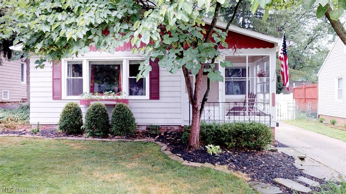 Must See Updated Ranch convenient to everything! You will love relaxing on the screened in front porch at least three seasons out of the year. Upon entering the home, you will immediately notice the beautiful hardwood floors, open concept and wood burning fireplace. The updated kitchen has tons of daylight and counter space, ample storage with oversized cabinets that include pull out drawers, breakfast bar with seating plus room for a table! For those more formal occasions or dinner parties, there is also a dining room. Around the corner there are three bedrooms, tons of closet storage and a full bathroom. On the lower level you will find the newly finished family room with recessed lighting, laundry room, second full bathroom and storage room. An excellent surprise awaits you out back! Not only is there an oversized 2-car garage with overhead storage, but also an attached 20x12 insulated workshop. The backyard is fully fenced, has a covered grilling area, is beautifully landsca