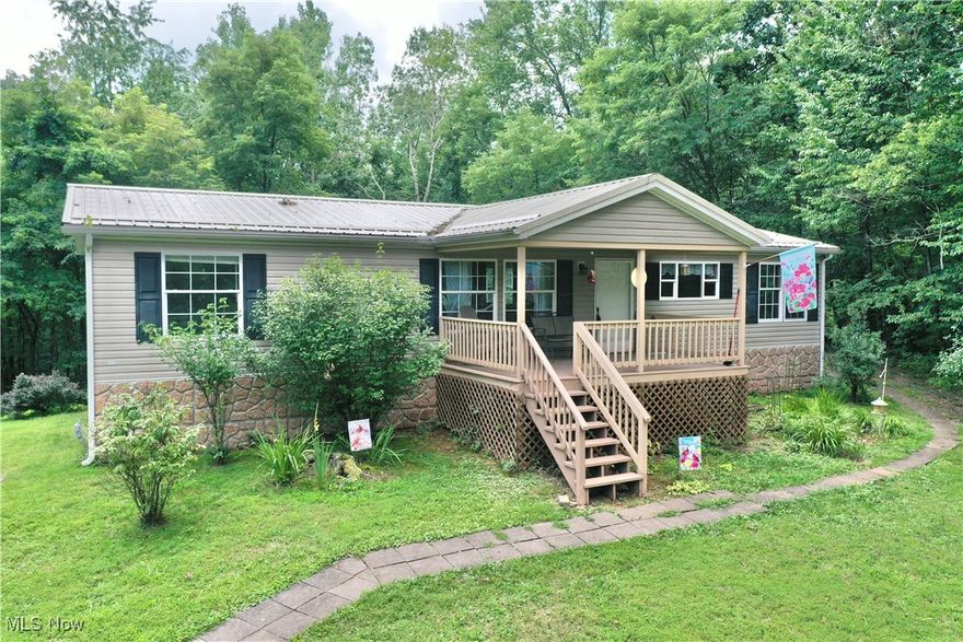 Concession to Buyer! 1196 Nobe Road, Big Bend, WV, is a well-kept home on a quiet country road, offering a mix of comfort and space just outside of town—perfect for full-time living or a peaceful retreat. This 3-bedroom, 2-bathroom doublewide home features 1,456 square feet of living space. Inside, a large open living room flows easily into a spacious eat-in kitchen, making it a comfortable space for daily living and entertaining. The master bedroom includes a generously sized master bath with a large soaking tub and separate shower, providing a private retreat at the end of the day. Outside, the home sits on 0.68 acres and features a large covered front porch—perfect for relaxing in a rocking chair or watching the sunset. There's ample space around the home to build a garage, set up a workshop, plant a garden, or even add a chicken coop or play area. Located on a quiet country road, this property offers just enough privacy while still being within easy driving distance to Grantsville and other nearby towns for work, school, or shopping. If you're looking for a low-maintenance home with space to grow in a peaceful setting, 1196 Nobe Road is worth a closer look.