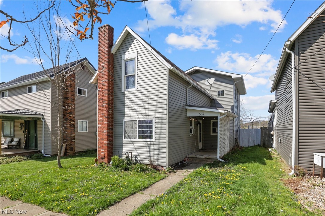NEW PRICE!! INVESTORS HANDIMAN SPECIAL FIXER UPPER AFFORDABLE!! This house is bigger than it looks & has a lot to offer! 3 bedrooms/ 2 full baths. New flooring through out; freshly painted; Bathrooms updated; 2 new ceiling fans in bedrooms. Plenty of Kitchen cabinets & counter tops space! Refrigerator, Stove & Dishwasher stay! 3 season room with windows. 1st floor laundry. Large barn/shed in backyard - USE CAUTION IF ENTERING. SELLER WILL NOT BE RESPONSIBLE. 3 parking areas in the back - access through the alley. Large backyard perfect for outdoor activities. Selling ''AS IS''.