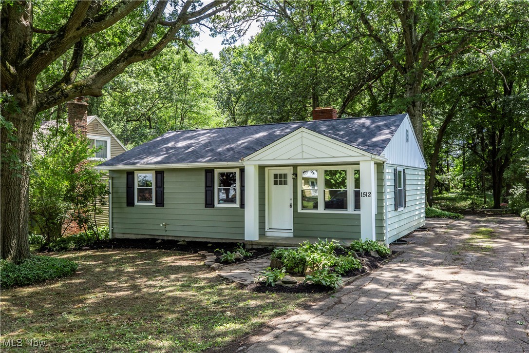 Welcome to your fully remodeled ranch in the heart of Cuyahoga Falls, perfectly situated on a quiet street with a stunning wooded backyard that backs directly to the fairway of Hole #11 on Brookledge Golf Course. Sitting on nearly half an acre (0.46 acres), this 3-bedroom, 1-bath home has been thoughtfully renovated from top to bottom in 2025. Major updates include a brand new architectural shingle roof, vinyl replacement windows, exterior doors, garage door and opener, and a brand new furnace and A/C (entire HVAC system). Inside, enjoy a totally redesigned kitchen featuring brand new cabinetry, leathered granite countertops, and stainless steel appliances. The bathroom has also been completely renovated with a new tub and surround, vanity, and toilet. Luxury vinyl plank flooring runs throughout the main living areas, with plush new carpet in the bedrooms. Fresh interior paint, updated hardware, fixtures, outlets, and switches make every corner feel brand new. The spacious living room features a cozy wood-burning fireplace, while the oversized knotty pine den adds extra living space and charm with its own wood-burning stove. You’ll also love the oversized 2-car attached garage with extra room for storage as well as a rear turn around that allows plenty of parking and a large hall closet that's the ideal spot to add a first-floor laundry if desired. Professionally refreshed landscaping adds great curb appeal. Minutes from shopping, restaurants, parks, highway access, a driving range, and even putt-putt golf—this is one you do not want to miss. Truly nothing left to do but move in and enjoy the view!