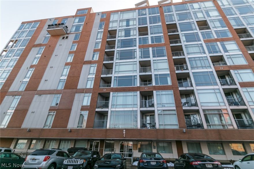 Corner unit with great light, views and parking! This northwest facing unit has stunning Lake Erie views, upgrades, amenities and tax abatement until 2020!  Enjoy floor to ceiling windows in your tastefully decorated condo with stainless steel appliances, granite counter tops and tile throughout. Wood floors flow from the entryway, through the kitchen and living room.  The bathroom features a walk-in tiled shower and granite counters. There are plenty of closets throughout the unit and a stacked washer/dryer allows for extra storage space. Enjoy the views from the outdoor patio space looking both north to Lake Erie and west to Gordon Square and Lakewood. The west bank of the flats has tons of development in the works!  Building includes fitness center, 24hr security, garage parking, minutes from Ohio City, Downtown, shopping and entertainment.