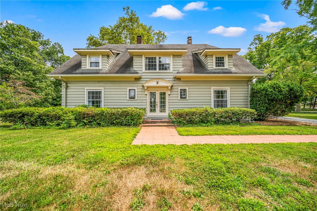 Welcome to this stunning 7-bedroom, 3.5-bath colonial estate situated on a picturesque 2.2-acre lot in sought-after Painesville Township. This expansive home offers timeless charm, abundant space, and unique features that make it truly one of a kind. Inside, you'll find a beautiful library perfect for quiet reading or a home office, as well as a spacious family room/den complete with a built-in bar perfect for entertaining. Large primary bedroom includes a beautiful full remodeled bath with a walk in shower. A screened-in patio offers a peaceful retreat to enjoy the surrounding nature. This property also includes a large detached garage and outbuilding that was once a rental property. It has since been fully gutted, offering a clean slate for your vision whether it's a guest house, studio, workshop, or future income property. With 7 bedrooms, 3.5 bathrooms, and endless potential both inside and out, this rare colonial is a must-see for anyone seeking space, character, and opportunity in a serene setting.