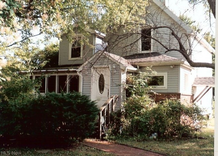 Terrific opportunity on this spacious older 2 story. includes two parcels totaling 1.9+acres.  3 bedrooms, 2 full baths. Walk out basement. Nice enclosed front porch.  Bank owned and sells as-is. Seller will not make repairs. All inspections at buyer cost.  Taxes in MLS cover both parcels, but buyer or buyer agent to verify all information.