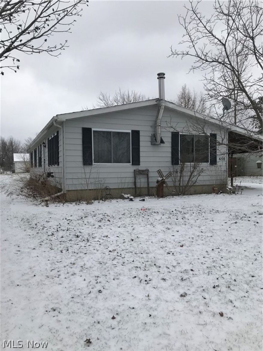 Ranch home with great potential. Large carport or use as a covered patio! Appliances included. Two source heating, propane furnace and free standing fireplace. Fireplace is an airtight woodburner. Furnace approximately 4 years old. New Water tank only a year old.