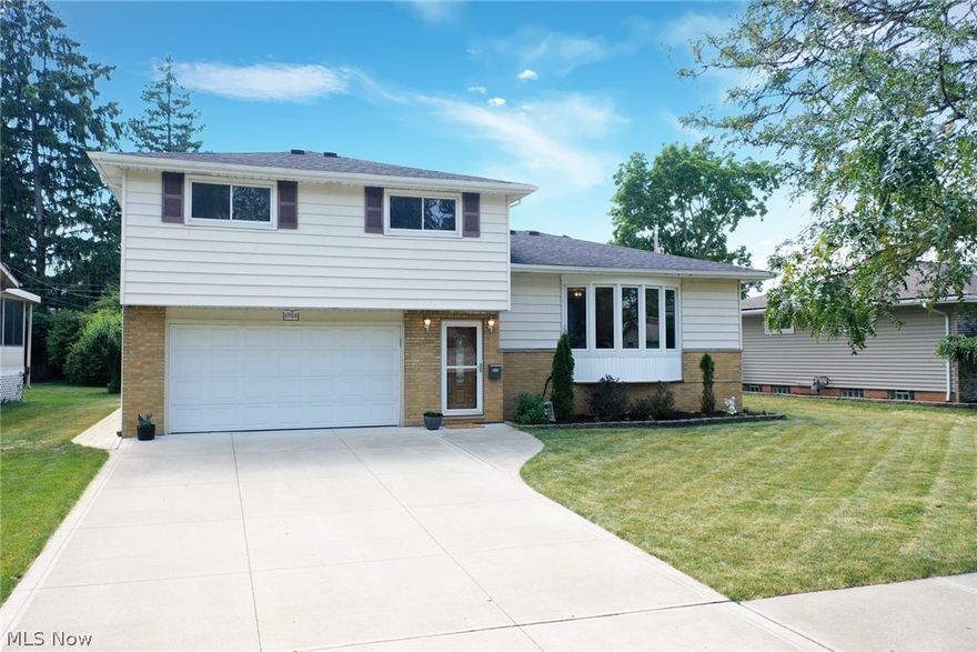 WELCOME TO this immaculate 4 bedroom, a full and two half bath FOUR-tiered split level with a gorgeous back yard patio and space! This neutral and remodeled home features spacious naturally light-filled rooms and an abundance of quality improvements and updates including: 2021 bay windows by Anderson*2018 asbestos mitigation blown-in insulation*2016 interior doors and closets*2015 extra wide concrete driveway sidewalks and stamped patio with side walkway & glass block windows*2014 high efficiency furnace, central air conditioning and whole-house humidifier*2013 hot water tank*2012 roof tear off*2010 kitchen including center island, cabinets, granite counter tops and tumbled stone backsplash*newer vinyl windows*exterior doors*all appliances including washer 2020 & dryer & kitchen including stainless refrigerator, gas stove, dishwasher 2020. Gas and electric range connection. Ceiling fans in all bedrooms. Deeper garage.