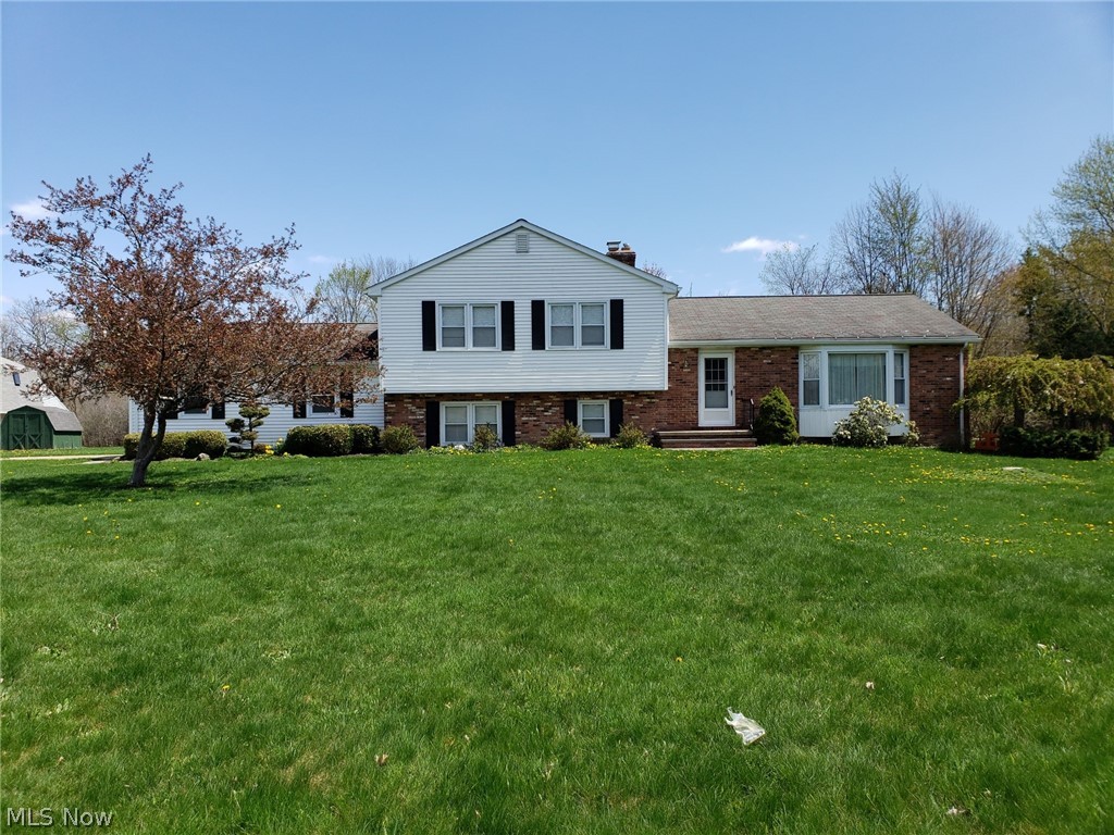 Room to Grow! 1966 square foot, 4 level split with four bedrooms on 5.6 acres. Updated kitchen and baths. Family room with fireplace and slider to huge park like backyard. Formal dining room perfect for family gatherings. Newer windows and furnace. Close to shopping and schools. Just Move In!