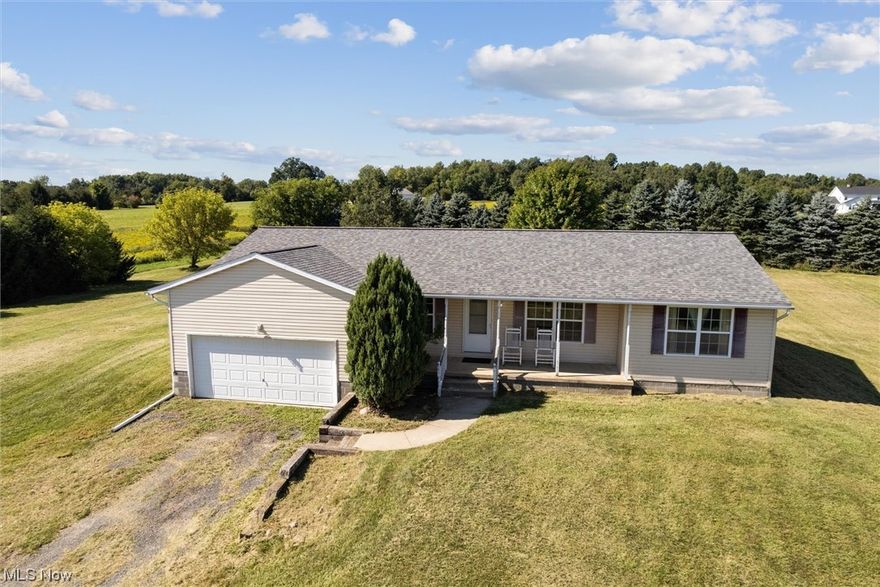 You don't want to miss this wonderful ranch home situated on 5 peaceful acres! As you step inside, you're greeted by a spacious open living and dining area that's perfect for relaxing and entertaining. The kitchen has plenty of room for a table, loads of cabinets, a pantry, and even a window to check out your huge backyard. Nearby you'll appreciate the 1st floor laundry that adds everyday convenience. The desirable split bedroom layout features two bedrooms and a full bath on one side and a private master suite with a walk-in closet and full bath on the other. The unfinished full basement is a blank canvas just waiting for your creative ideas to finish for even more living space. The home features a 2 car attached garage plus there's plenty of land to add a pole building or even a pool! True one floor living and a beautiful setting surrounded by farmland and country views! Don't miss out, schedule your showing today!