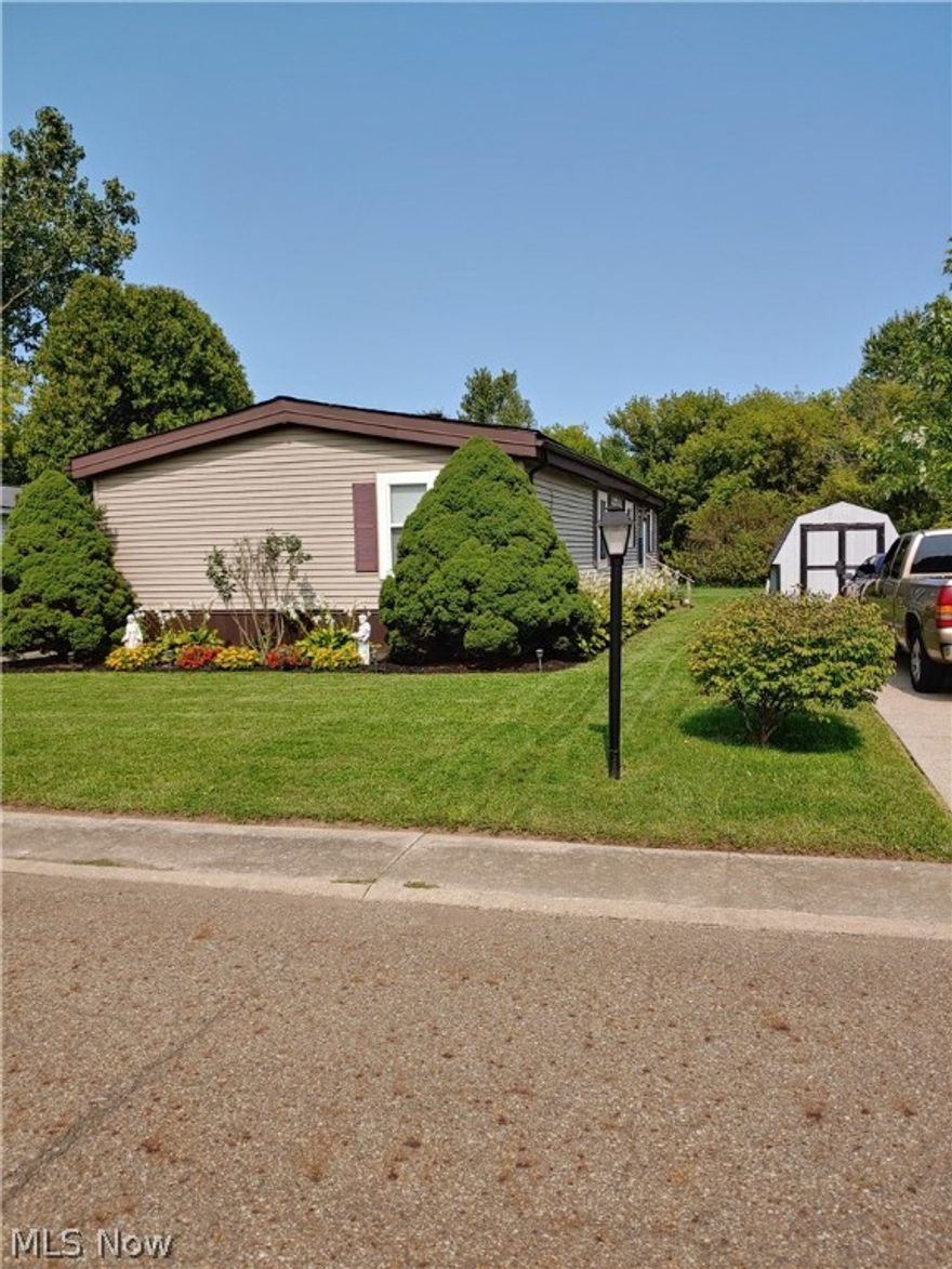 Double Wide Mobile with 3 bedrooms and 2 baths, plus bonus room.  Come view this spacious remodeled unit with new interior drywall, large eat-in kitchen, remodeled bathrooms, large laundry room, freshly painted and newer flooring.