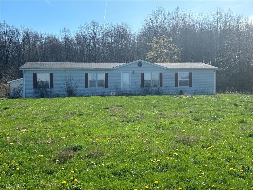 Located on a country road in Kinsman Township this 3 bedroom home with full basement and detached garage sits on 5.5  acres.  Home needs some TLC.  Carpeting needs replaced and everything needs a good cleaning to make this your comfortable country dwellimg.  Don't pass up this diamond in the rough.